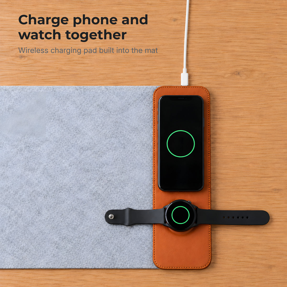 Phone and watch charging together on the built-in wireless pad