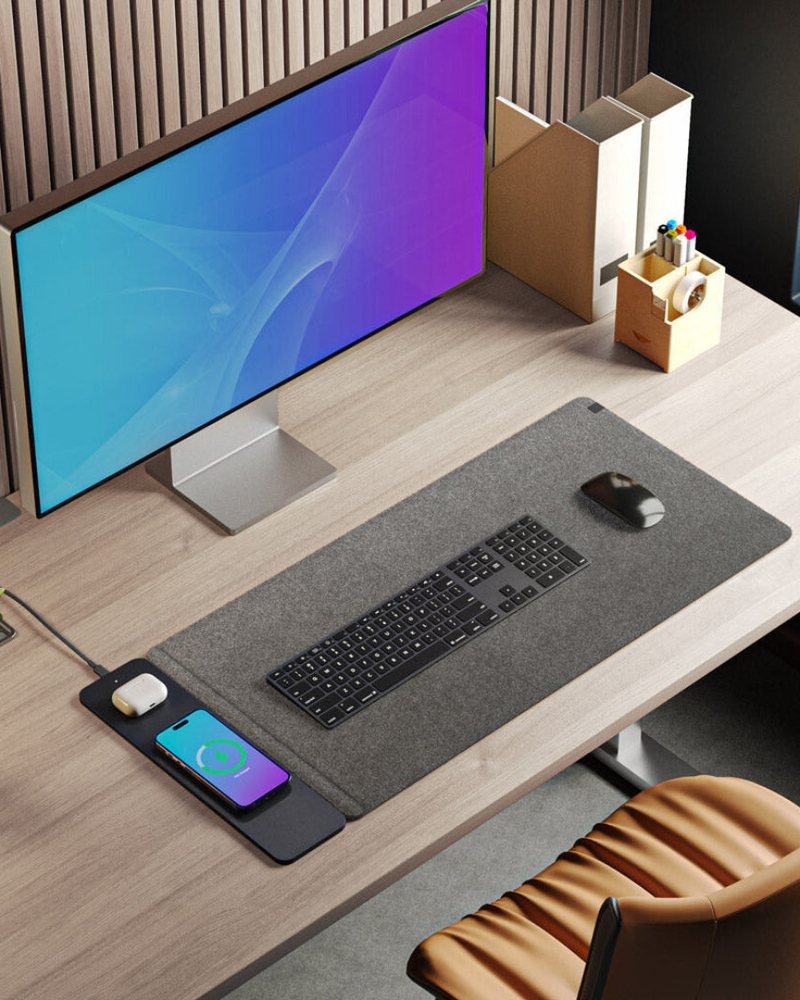 A full desk setup built around a Chemistors wireless charging desk mat