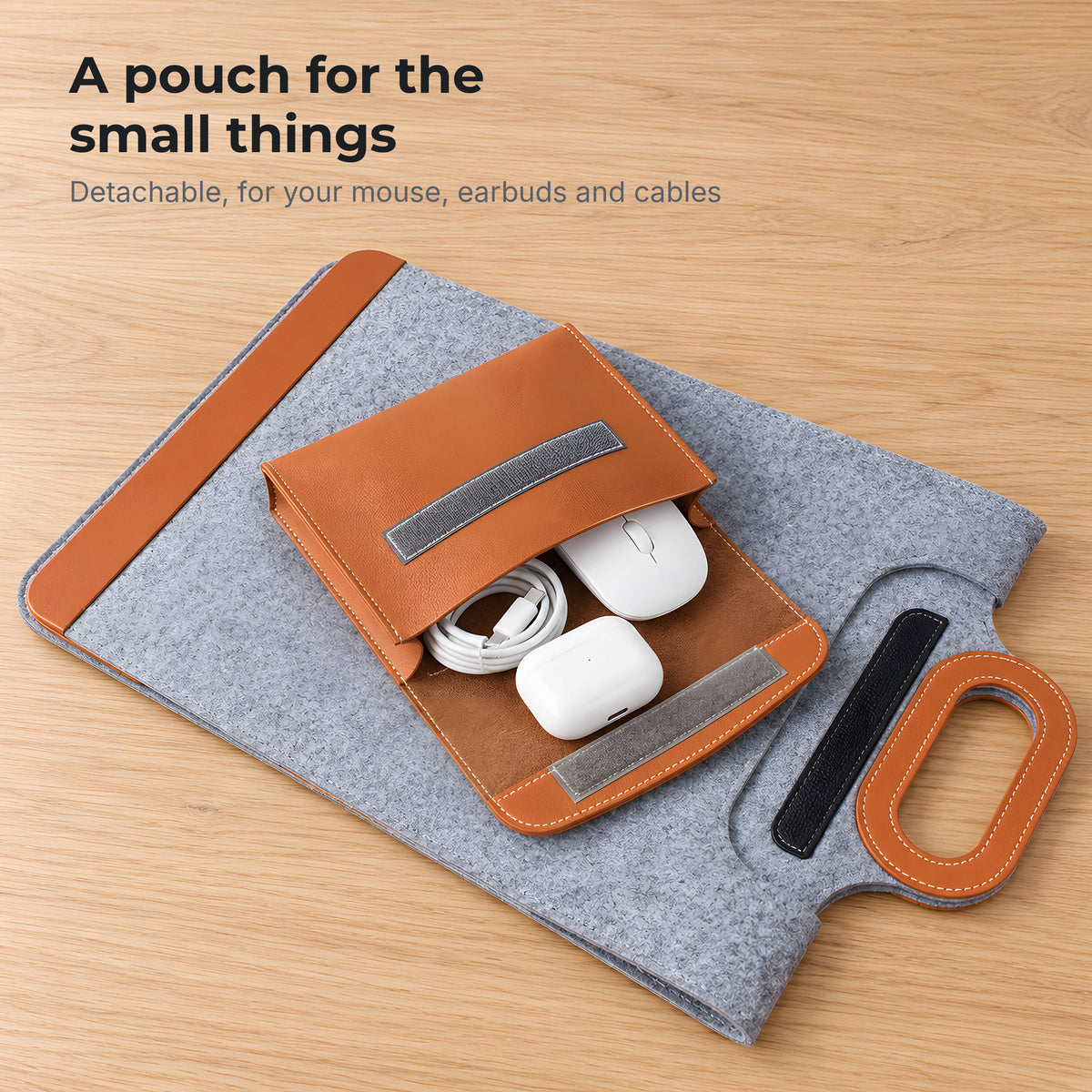 Detachable tan pouch holding a mouse, earbuds and cables